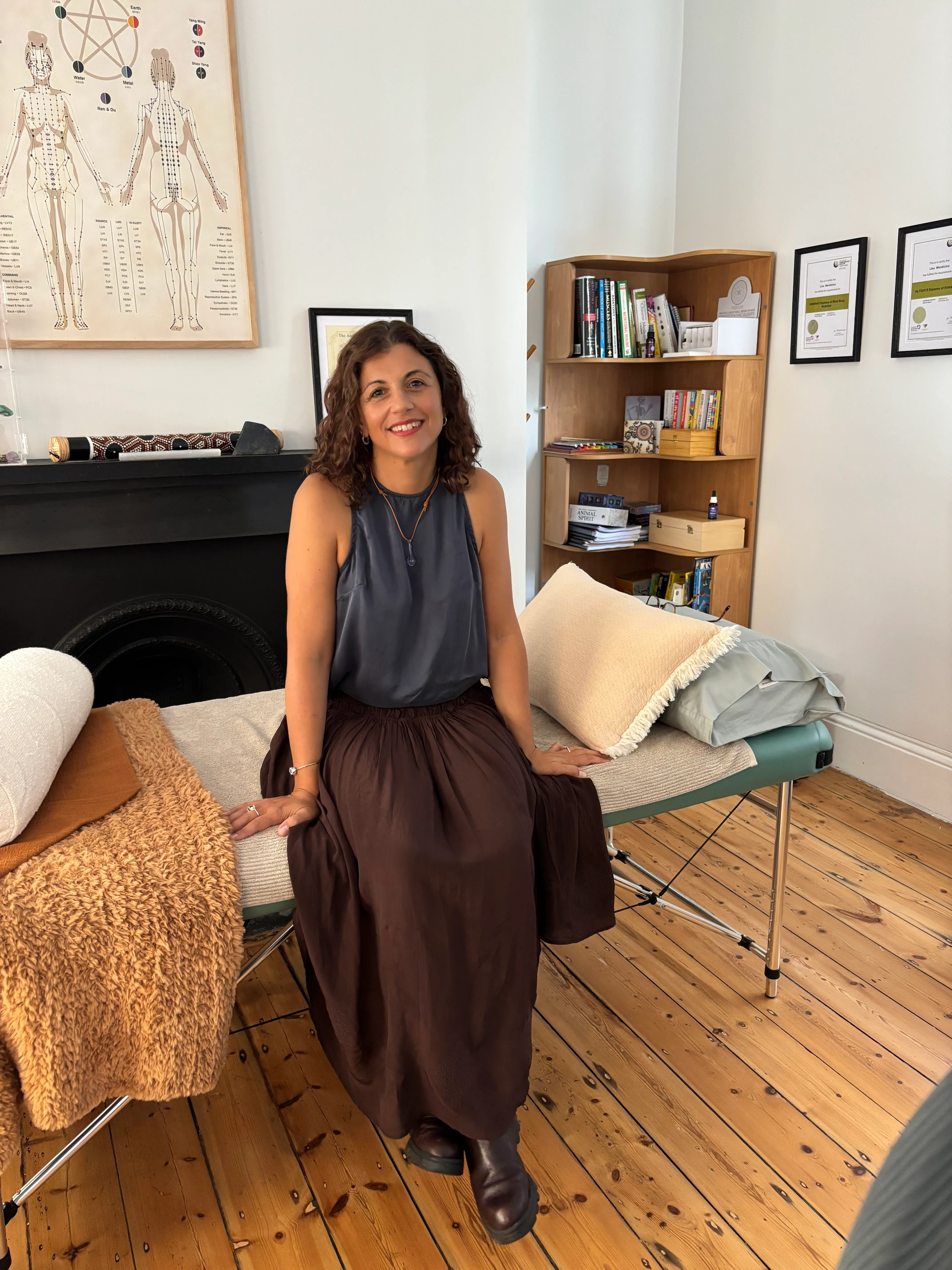 Lisa Mendicino, founder of Saoura, seated in her treatment room